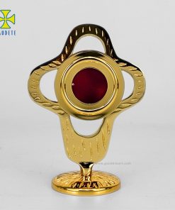 Reliquary in gilded brass cross symbol